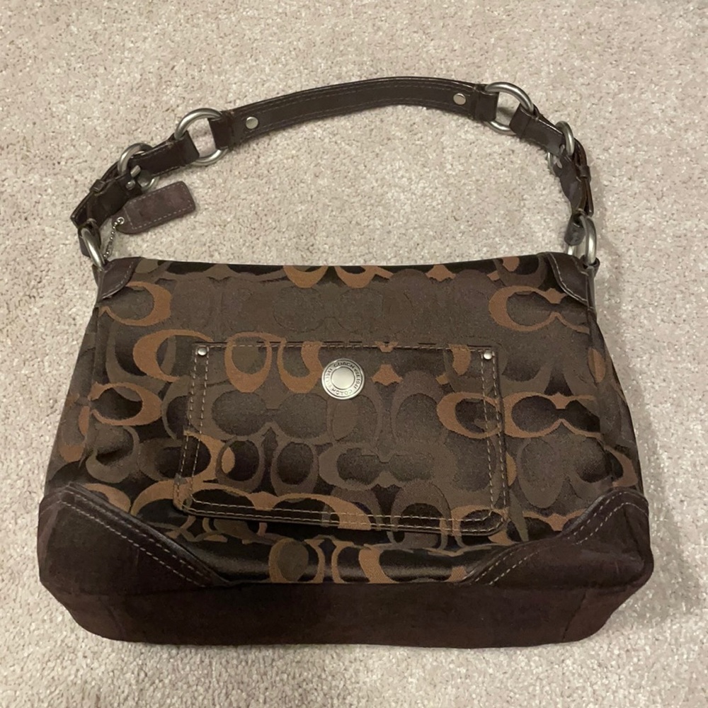 Brown Coach purse with iconic C print
